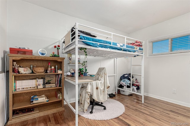 bedroom featuring hardwood / wood-style floors