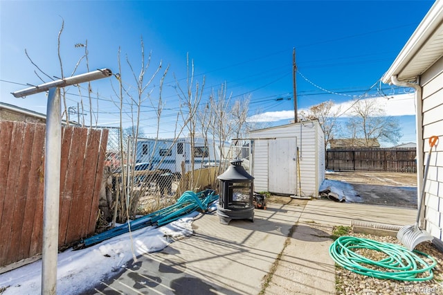 view of patio / terrace with a shed