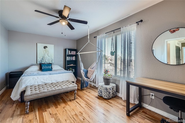 bedroom featuring ceiling fan and hardwood / wood-style flooring