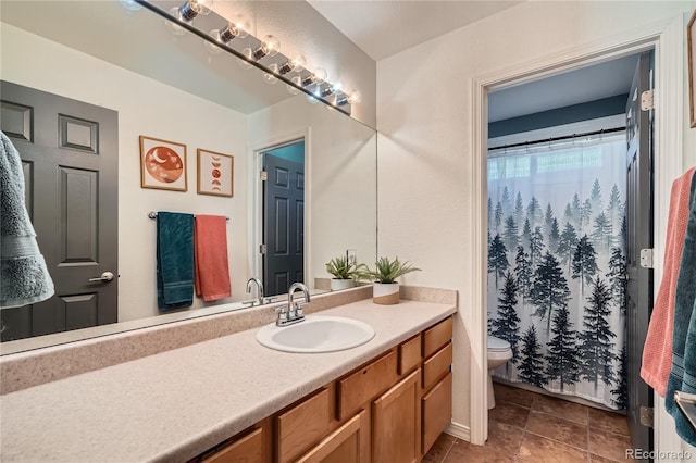 bathroom featuring toilet and vanity