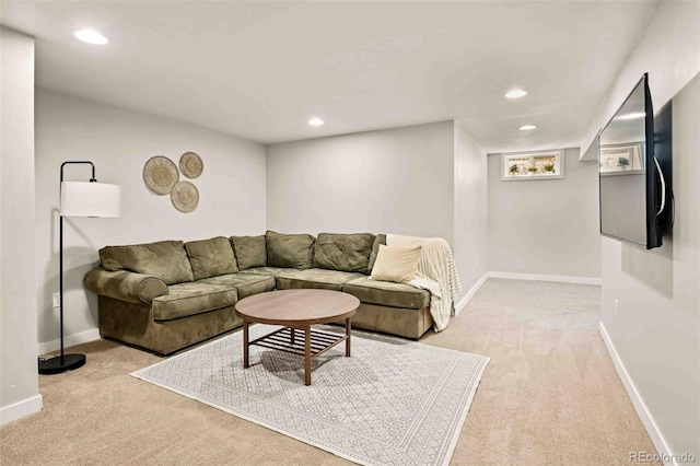 living room with recessed lighting, light carpet, and baseboards