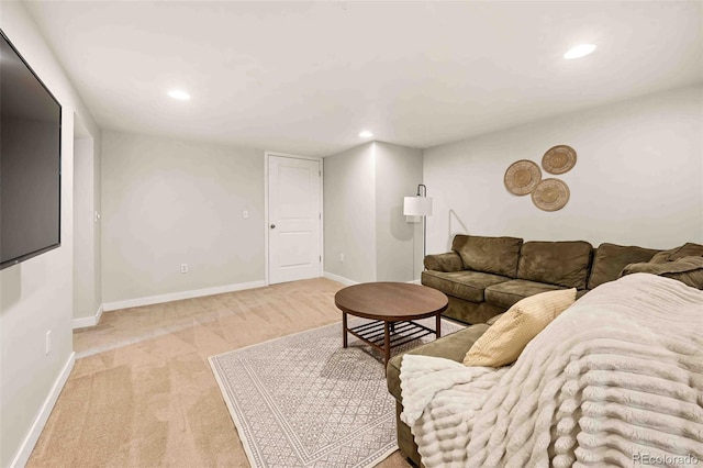 living room with baseboards, light colored carpet, and recessed lighting