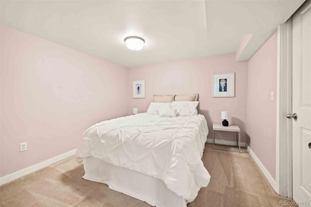 bedroom featuring carpet floors and baseboards