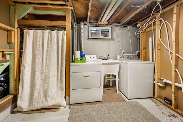 laundry room featuring laundry area and washer and clothes dryer