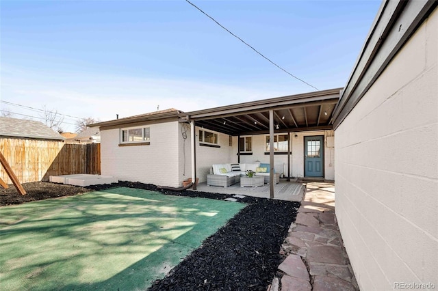 exterior space featuring fence and an outdoor hangout area