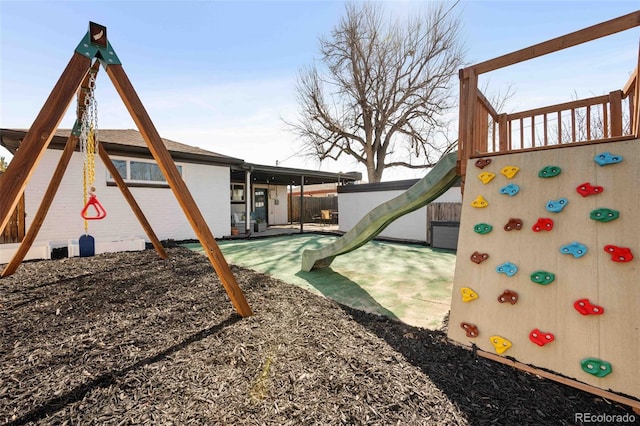 view of play area featuring fence