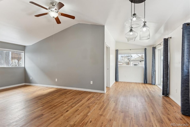 interior space with lofted ceiling, light hardwood / wood-style floors, and ceiling fan