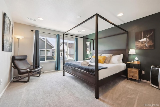 carpeted bedroom featuring baseboards and recessed lighting