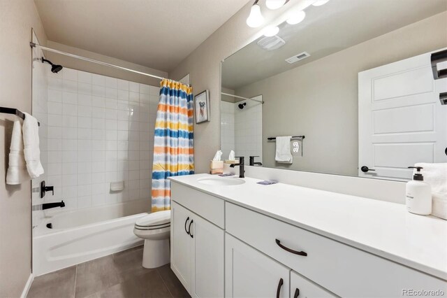 full bathroom featuring tile patterned flooring, shower / bath combo, vanity, and toilet