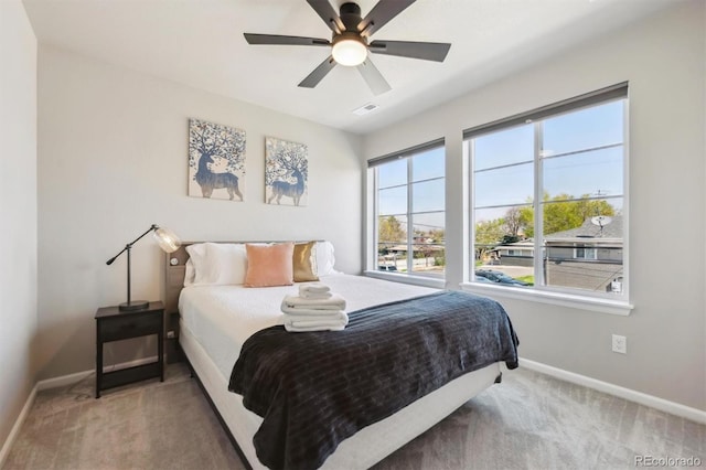 bedroom with baseboards, carpet flooring, and ceiling fan
