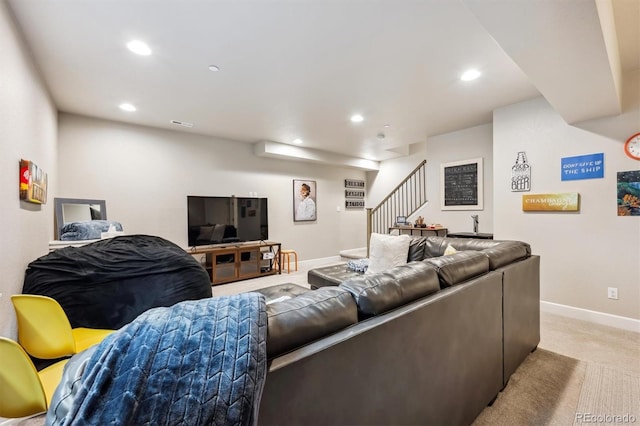 living area featuring stairs, baseboards, light carpet, and recessed lighting