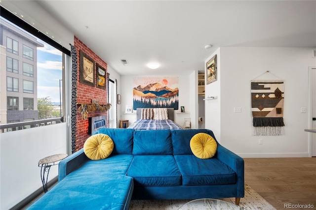 1898 S Bannock St Unit 202, Denver, CO 80223 - living room with wood finished floors, a fireplace, and baseboards