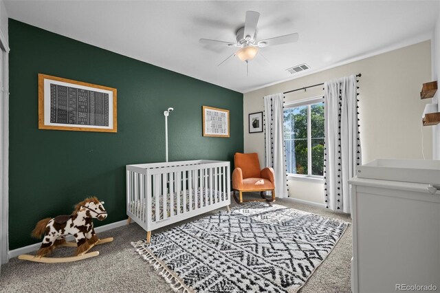 4975 S Zephyr St, Littleton, CO 80123 - carpeted bedroom featuring a crib and a ceiling fan