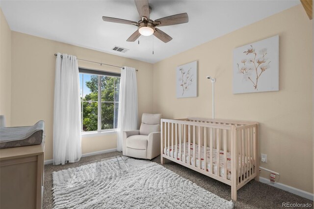 4975 S Zephyr St, Littleton, CO 80123 - carpeted bedroom with a nursery area and ceiling fan