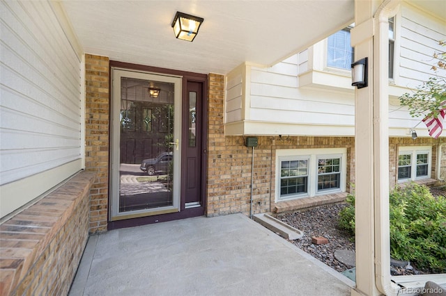 11797 W Aqueduct Dr, Littleton, CO 80127 - entrance to property with brick siding