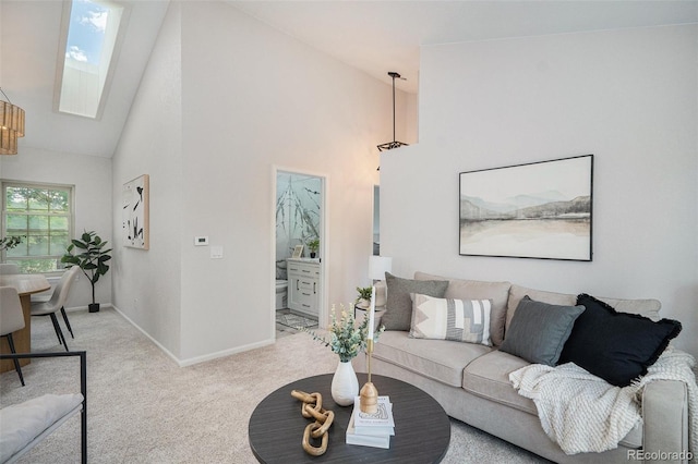 11797 W Aqueduct Dr, Littleton, CO 80127 - living area featuring a skylight, high vaulted ceiling, and carpet floors