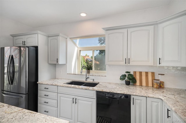 11797 W Aqueduct Dr, Littleton, CO 80127 - kitchen with dishwasher, freestanding refrigerator, tasteful backsplash, light stone countertops, and white cabinets