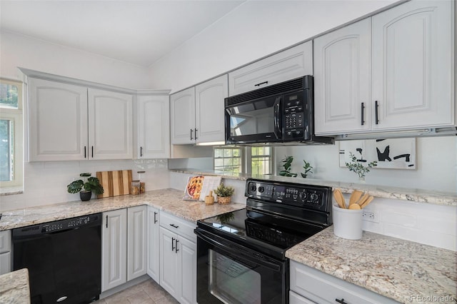 11797 W Aqueduct Dr, Littleton, CO 80127 - kitchen with black appliances, decorative backsplash, white cabinetry, and light stone countertops