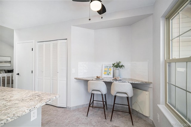 11797 W Aqueduct Dr, Littleton, CO 80127 - dining area featuring ceiling fan and baseboards