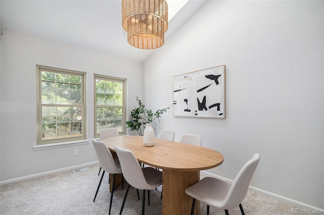 11797 W Aqueduct Dr, Littleton, CO 80127 - dining room with lofted ceiling, carpet flooring, and a chandelier