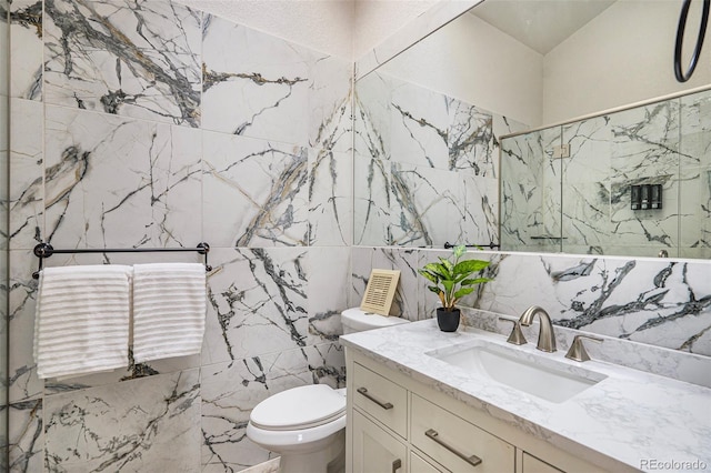 11797 W Aqueduct Dr, Littleton, CO 80127 - full bathroom featuring tile walls, a marble finish shower, and vanity