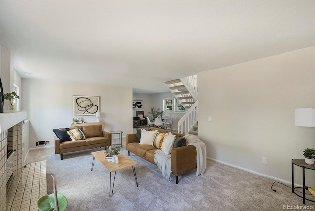 11797 W Aqueduct Dr, Littleton, CO 80127 - living area with stairs, carpet floors, and a brick fireplace
