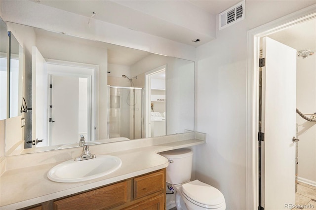 11797 W Aqueduct Dr, Littleton, CO 80127 - bathroom with washer and dryer, a shower stall, and vanity