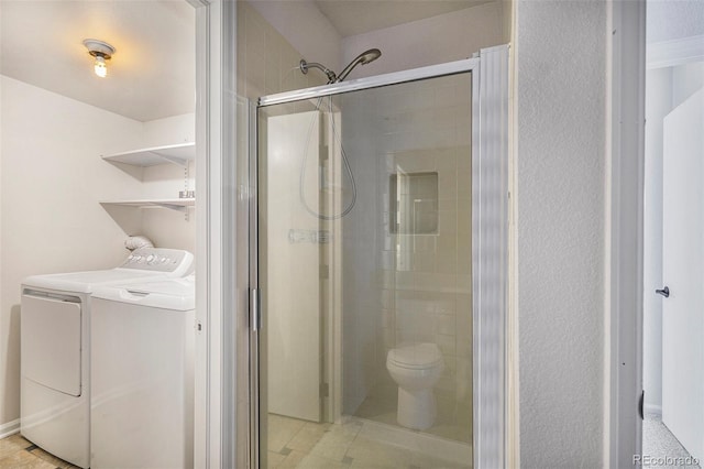 11797 W Aqueduct Dr, Littleton, CO 80127 - full bathroom with separate washer and dryer and a stall shower