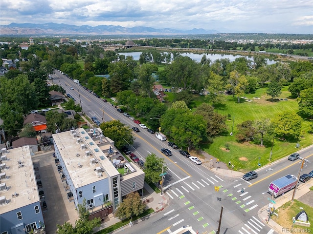 drone / aerial view with a water and mountain view