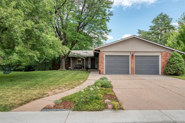 3196 S Newport St, Denver, CO 80224 - ranch-style house with a garage, driveway, a front yard, and brick siding