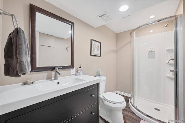 3196 S Newport St, Denver, CO 80224 - full bath with a shower stall, wood finished floors, vanity, and recessed lighting
