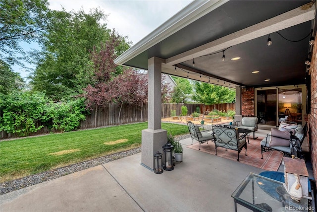 3196 S Newport St, Denver, CO 80224 - fenced backyard featuring an outdoor hangout area and a patio area