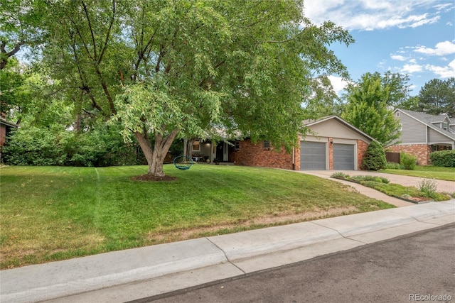 3196 S Newport St, Denver, CO 80224 - obstructed view of property featuring driveway, a garage, and a front lawn