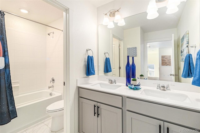 full bathroom with shower / tub combo with curtain, vanity, and toilet