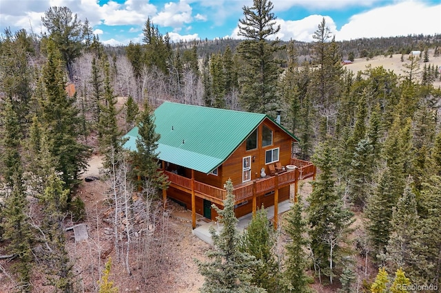 birds eye view of property with a wooded view