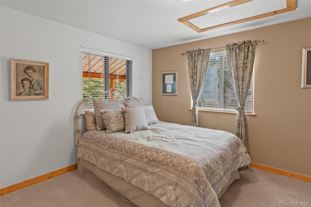 bedroom featuring carpet flooring and baseboards