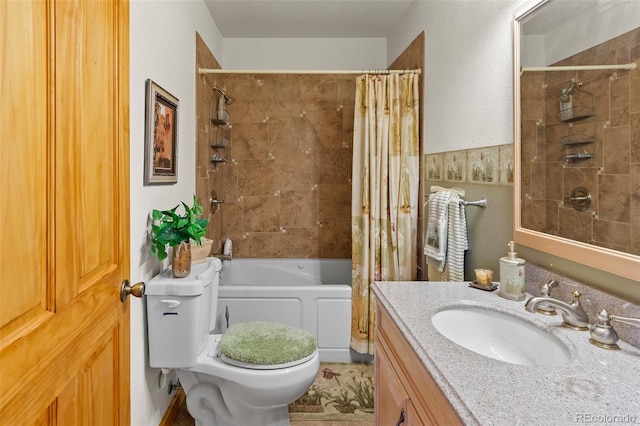 bathroom featuring toilet, shower / tub combo with curtain, and vanity