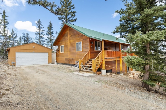 view of side of property featuring an outbuilding and a detached garage