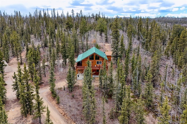 aerial view featuring a wooded view