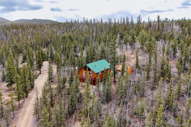 bird's eye view with a mountain view and a forest view