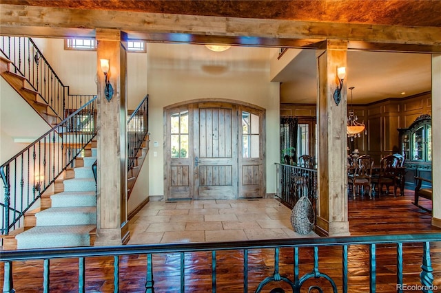 foyer entrance with beam ceiling