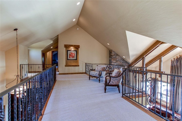 hall featuring lofted ceiling and carpet flooring