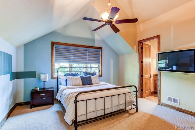 bedroom featuring lofted ceiling, ceiling fan, and light colored carpet