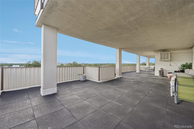 view of patio featuring a wall mounted air conditioner