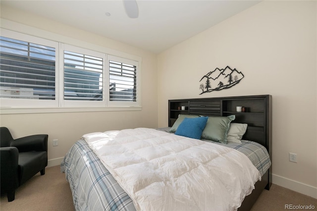 bedroom featuring carpet floors, vaulted ceiling, and ceiling fan