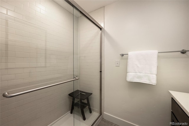 bathroom with vanity and an enclosed shower