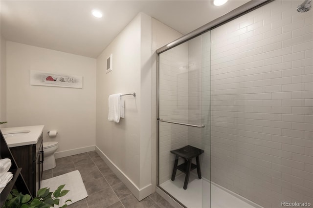 bathroom with tile patterned floors, vanity, toilet, and a shower with shower door