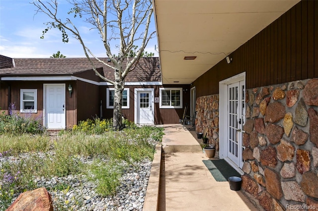 view of exterior entry featuring french doors