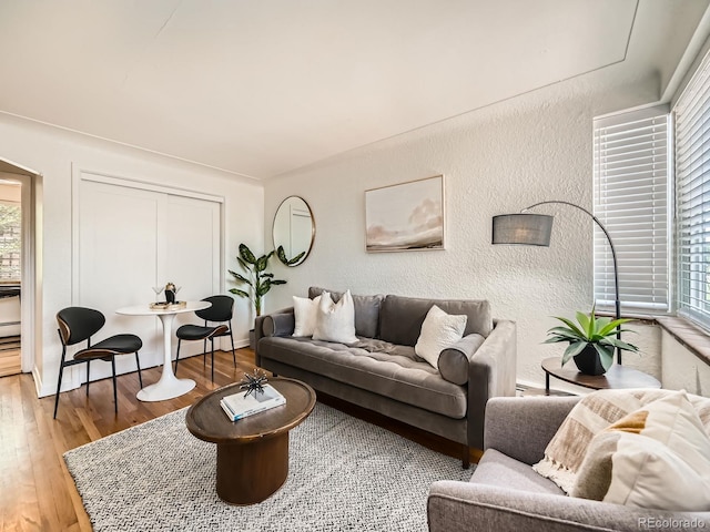4418 W 11th Ave, Denver, CO 80204 - living room featuring a textured wall and wood finished floors