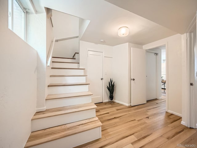 4418 W 11th Ave, Denver, CO 80204 - stairs featuring wood finished floors and baseboards